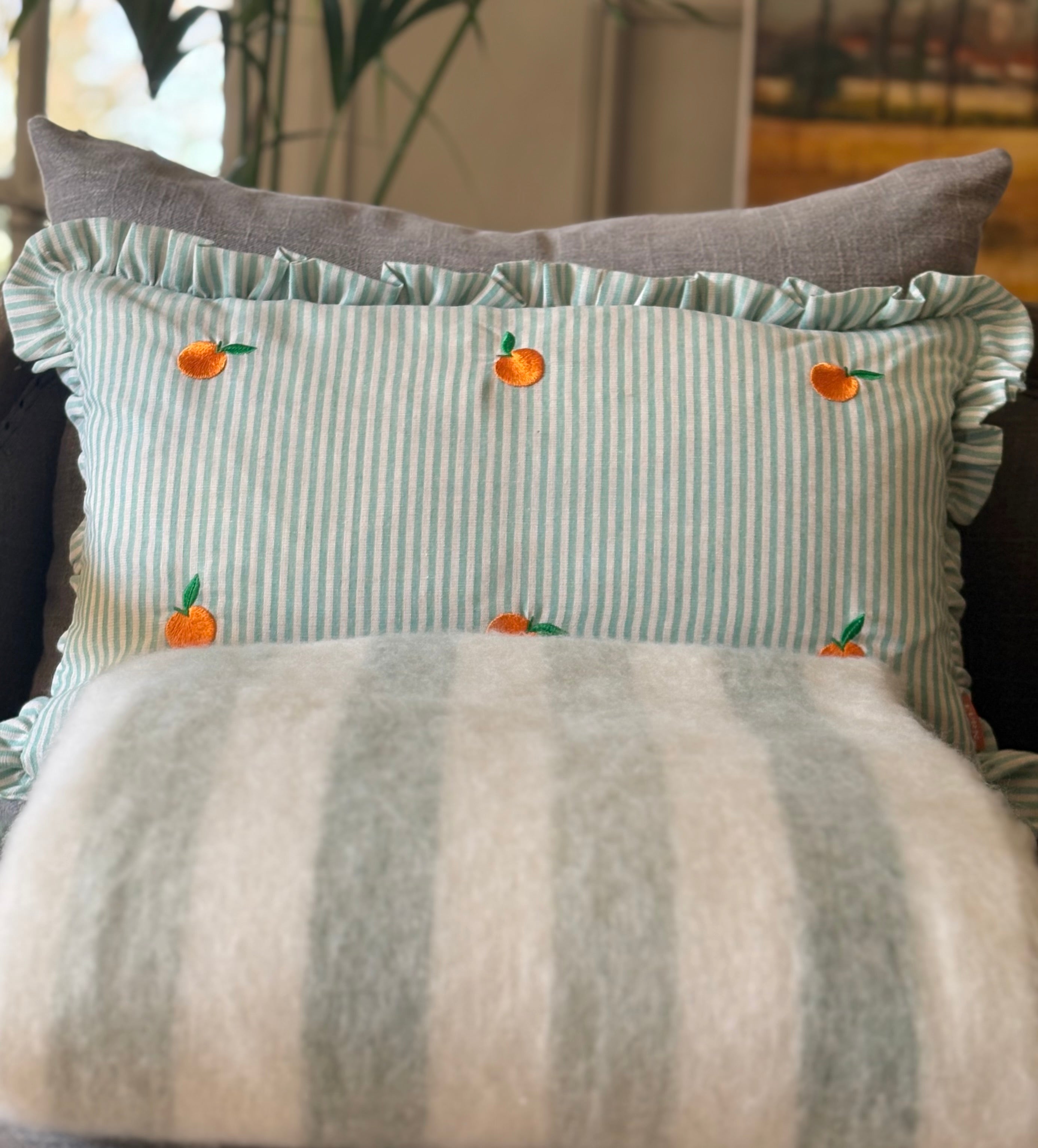 Striped Green Cushion with Oranges detail